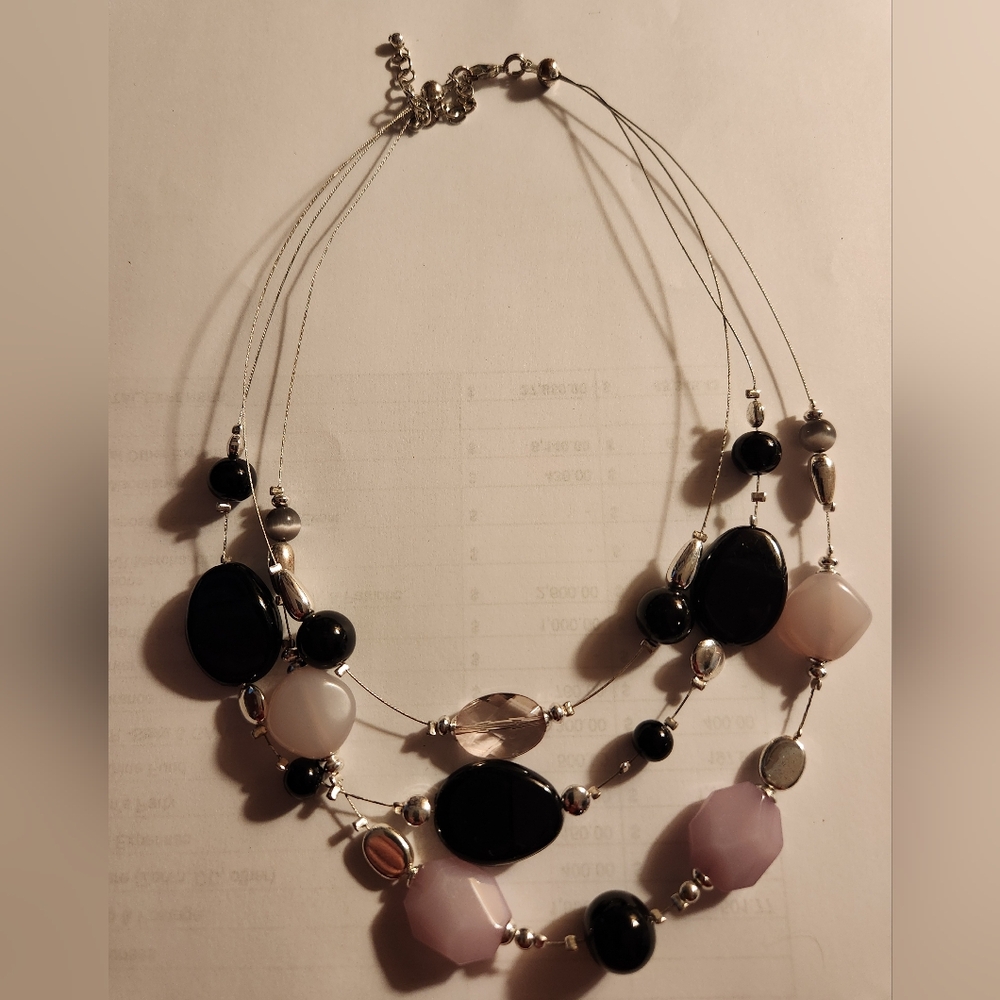 Black and silver colored necklace